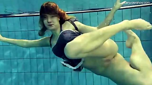 Underwater with a shaved pussy teen girl