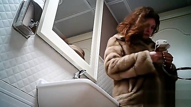 Women pee in public toilet 2273