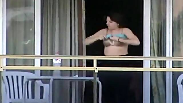 Peep on neighbor girls tits on a balcony