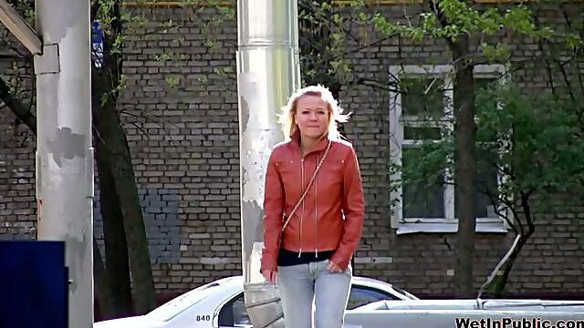 Blonde whore in leather jacket gets her pants wet with her own piss
