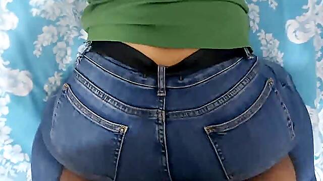 Big ass in doggystyle fucked through tight jeans