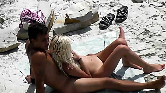 Pale hot blonde fucks at the beach (real voyeur)