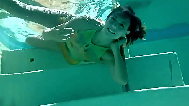 Japanese swimsuit goddess in shiny PVC