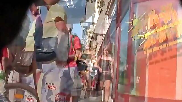 Street cam catches a scantly clad girl shopping