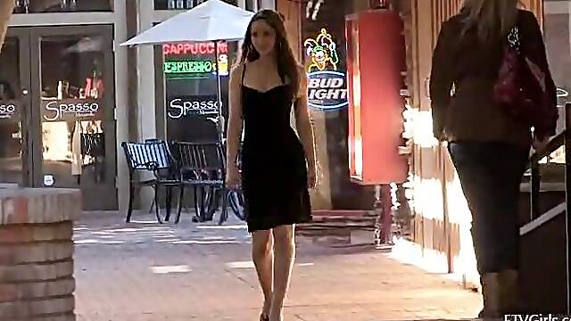 Sexy outdoor strip show by lovely babe Dani in black dress