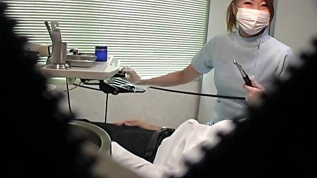 Japanese dentist enjoys stroking a dick of her very lucky patient