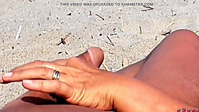 That babe shows her butt on the beach of Cap dAgde and jerks off her snatch and then her boyfriends penis with voyeurs