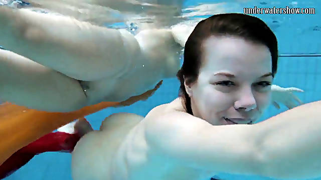 Two cuties submerged underwater