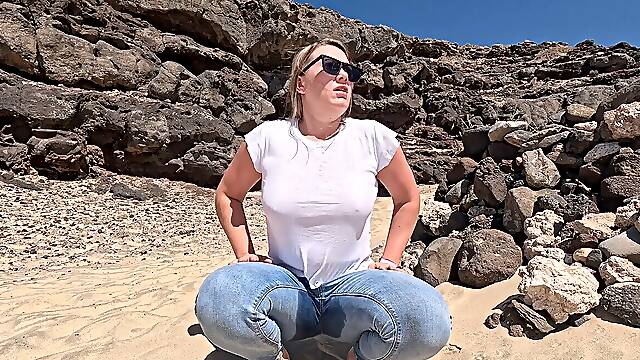 Desperate piss soaking denim in public beach