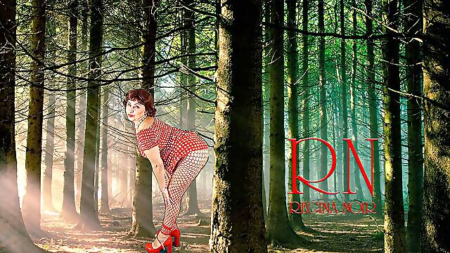Pin-up lady posing in the forest. She shows her tits and pussy. Mesh tights. Special effect.