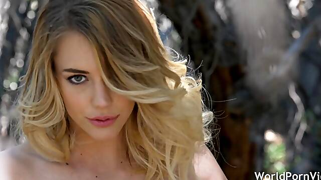 Blonde beauty alone in the forest