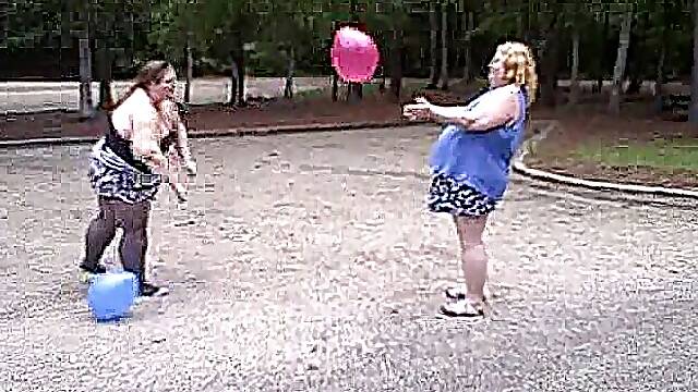 BBW gals play volley ball with balloons