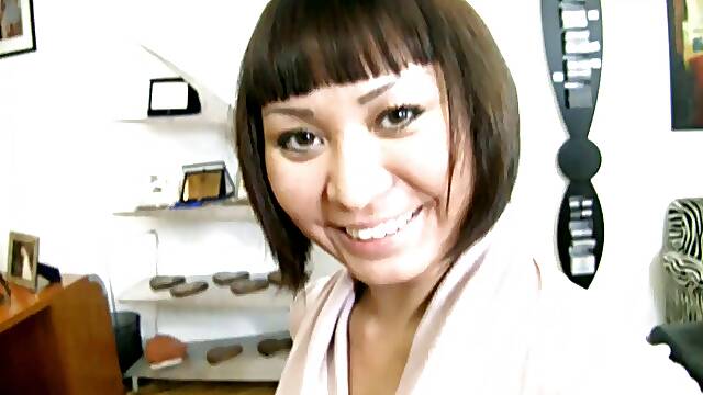 Asian babe takes it deep in her ass